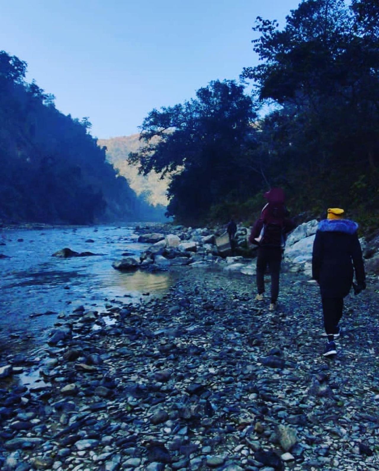Apart from posting pictures of Virat and Vamika, the actor also shared a picturesque photo of a flowing river and mountains. In one of the photos, the trio can be seen walking alongside a rocky river bank. 